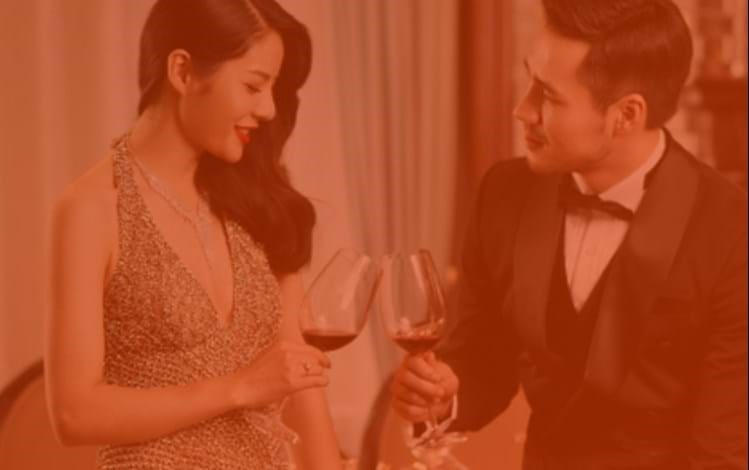 Affluent people at a dinner toasting